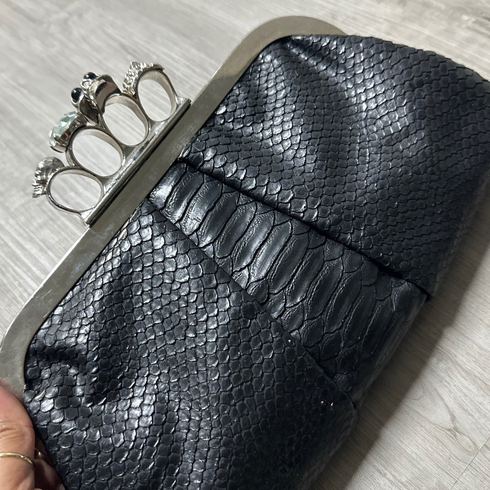 Black leather knuckle clutch